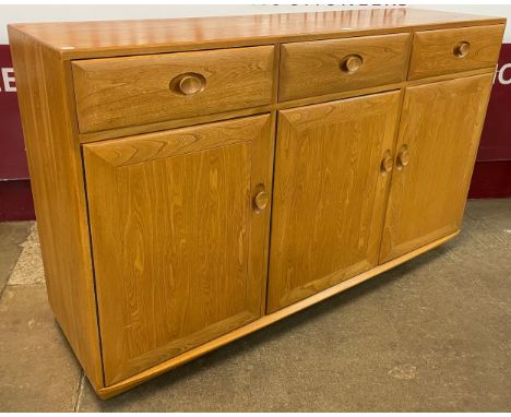 An Ercol Blonde elm Windsor sideboard 