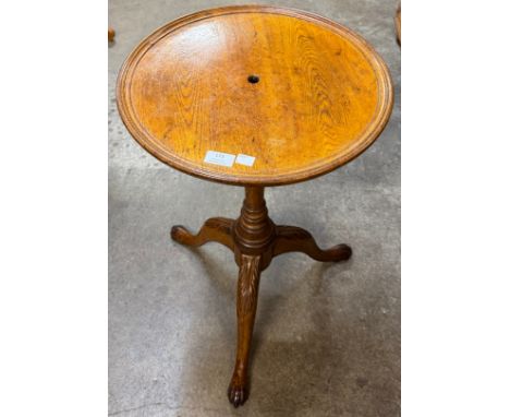 A Victorian carved oak tripod wine table 