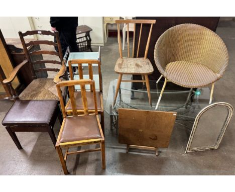 An oak ladderback farmhouse chair, a leather footstool, an Ercol 391 model chair, etc.