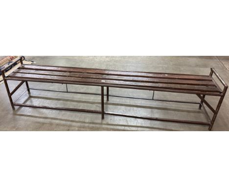 A large pine and tubular metal bench 
