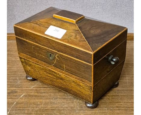 A Regency inlaid rosewood sarcophagus shaped tea caddy 