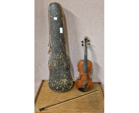 A cased violin (length of back inc. button 35cm) and bow 