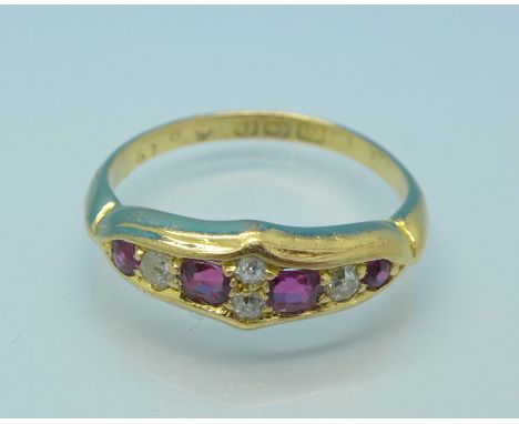 An 18ct gold, eight stone ruby and diamond ring, 3.46g, N