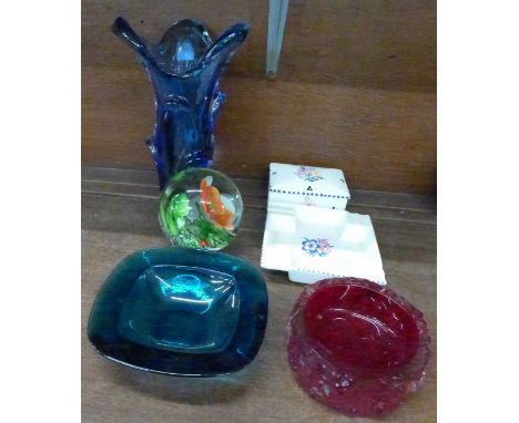 A Poole trinket box and Poole ashtray, a large glass paperweight, a continental heavy blue glass vase, a bark red glass ashtr