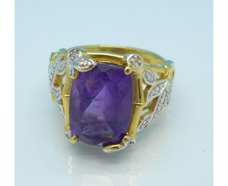 A silver gilt, amethyst and four diamond ring, R