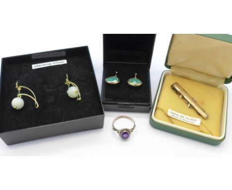 A pair of earrings with jade drops, one other pair of earrings, a silver ring and a tie-clip