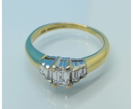 An 18ct gold, five stone baguette diamond ring, total diamond weight 0.40 carats, 3.1g, I