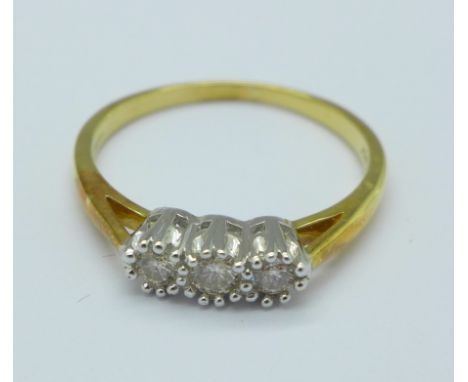 An 18ct gold and three stone diamond ring, 3.5g, S