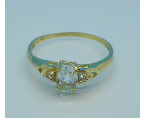 A 9ct gold, blue stone and diamond ring, 1g, N