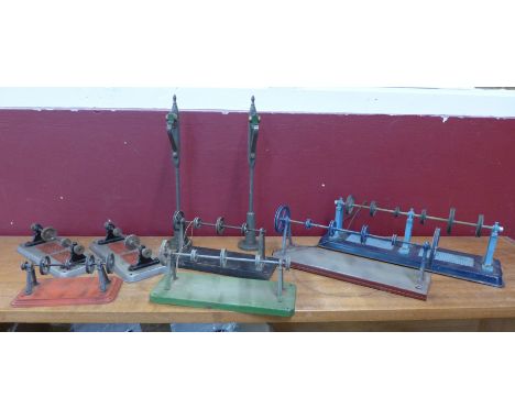 A collection of engine pulleys, model rail lamp posts, etc.
