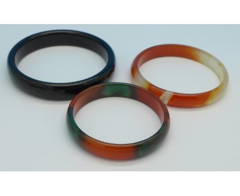 A family set of three jade bangles