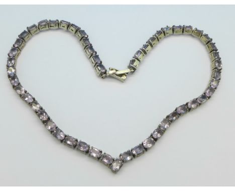 A silver and amethyst necklace