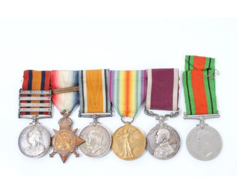 Boer War and later Long Service and Good Conduct medal group - comprising Queen's South Africa medal with four clasps - Orang