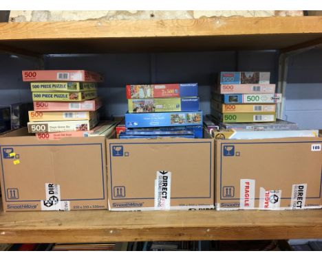 A shelf of boxed jigsaw puzzles