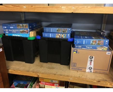 A shelf of boxed jigsaw puzzles