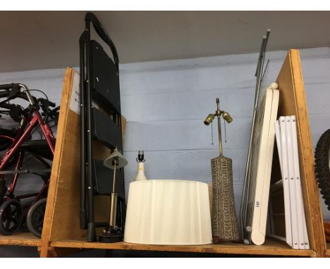 A shelf of assorted to include steps, lamp, shade etc.