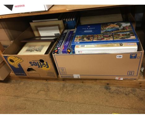 A shelf of jigsaw puzzles, books and framed prints (local interest)