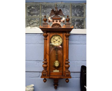 19th century Vienna wall clock, the architectural case with eagle mount and glazed door, the dial with Arabic numerals to a b