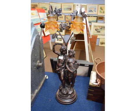 Bronzed resin two-light table lamp with figural base, 80cm high