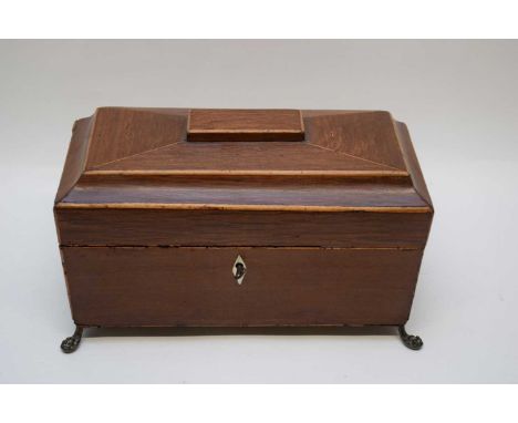 Georgian mahogany sarcophagus formed tea caddy with hinged lid and sub-divided interior, raised on brass feet, 32cm wide