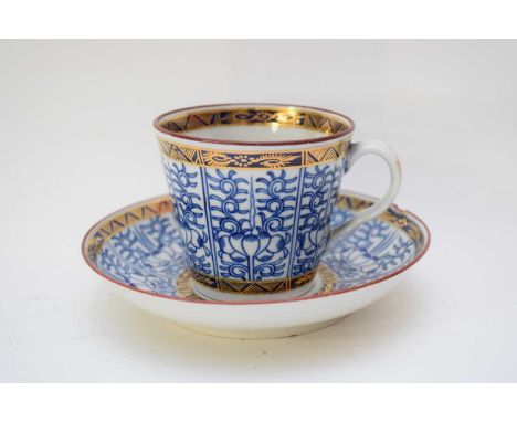 18th century Worcester bucket shaped cup and saucer with the Royal Lily pattern, factory crescent mark to base