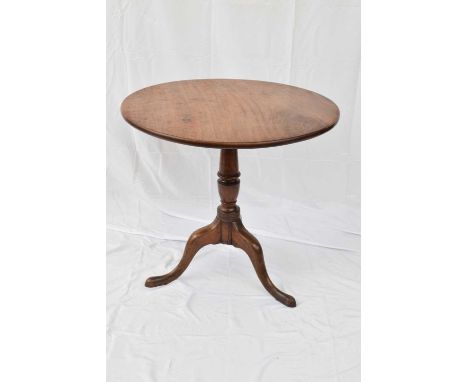 Georgian mahogany tilt-top table with circular top supported on a turned column and tripod base, top 77cm diam