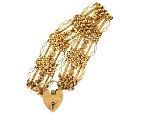 A FANCY LINK TEXTURED GOLD BRACELET, MARKED 9CT, 20G++LIGHT SCRATCHES TO PADLOCK CONSISTENT WITH AGE, GOOD CONDITION OVERALL 