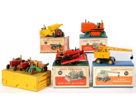 FOUR DINKY SUPERTOYS, COMPRISING BLAW KNOX BULLDOZER 561, DUMPER TRUCK 562, HEAVY TRACTOR 563 AND COLES MOBILE CRANE 571, ALL