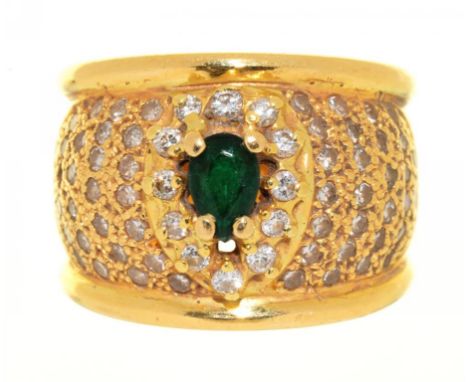 AN EMERALD AND DIAMOND COCKTAIL RING, IN GOLD MARKED 750, THE OVAL FACETED  EMERALD APPROX 0.4 CT, BRILLIANT CUT DIAMONDS APP