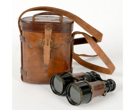 A PAIR OF WORLD WAR ONE FRENCH BLACK PAINTED BRASS AND PIGSKIN COVERED BINOCULARS BY L. PETIT, MARK V, IN LEATHER CASE, STAMP