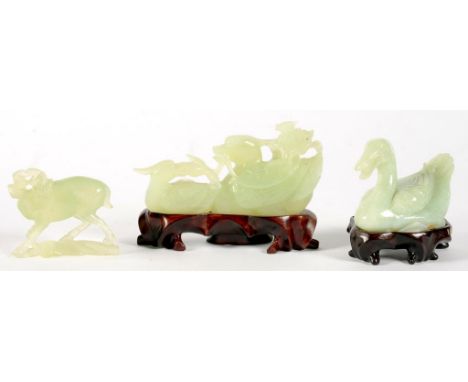 A CHINESE JADE CARVING OF A SWAN, 6.5CM H, AFFIXED WOOD BASE, ANOTHER, OF DUCKS AND A SMALLER STONE CARVING, ALL 20TH C