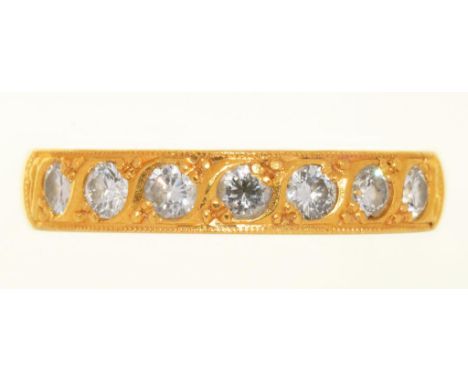 A DIAMOND RING ADAPTED FROM A 22CT GOLD WEDDING RING, BIRMINGHAM 1923,  THE SEVEN BRILLIANT CUT DIAMONDS APPROX 0.50 CT, 5.5G