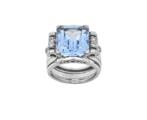 A Synthetic Blue Spinel and Diamond Ringthe emerald-cut blue synthetic spinel in a white claw setting, to eight-cut diamond s