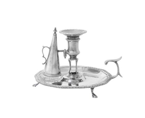 A George III Silver Chamber-Candlestick,  by William Cafe, London, 1763 the base shaped circular and on three stepped scroll 