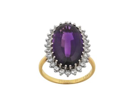 An Amethyst and Diamond Cluster Ringthe oval cut amethyst within a border of round brilliant cut diamonds, in white claw sett
