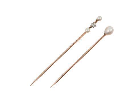 Two Pearl Stick Pinsan oval shaped pearl on a yellow pin with a mid-way twist; and a round shaped pearl suspends an old cut d