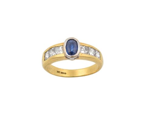 An 18 Carat Gold Sapphire and Diamond Ring the oval cut sapphire in a white claw setting, to princess cut diamond set shoulde