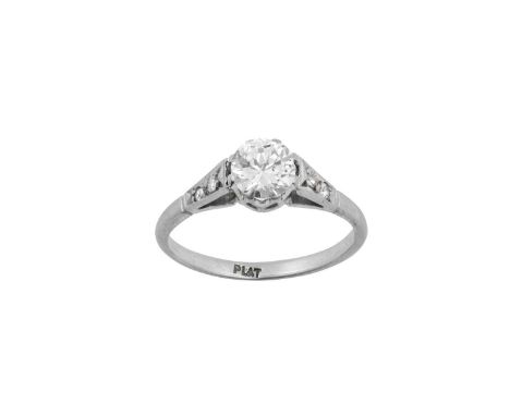 A Diamond Solitaire Ringthe round brilliant cut diamond in a white claw setting, to eight-cut diamond set shoulders, on a pla