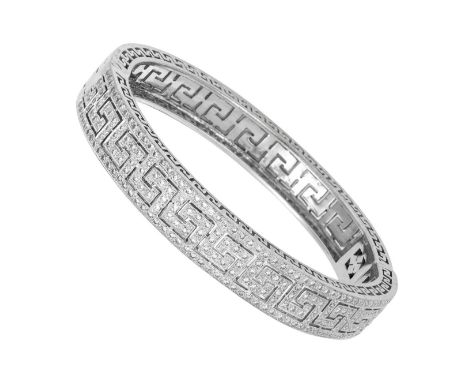 An 18 Carat White Gold Diamond Hinged Bangle the Greek key motif set throughout with round brilliant cut diamonds, in claw an