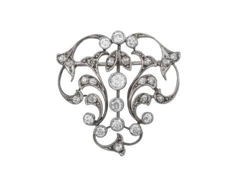 A Diamond Brooch, circa 1910of open scrollwork form, set throughout with old cut and eight-cut diamonds, in white claw and mi