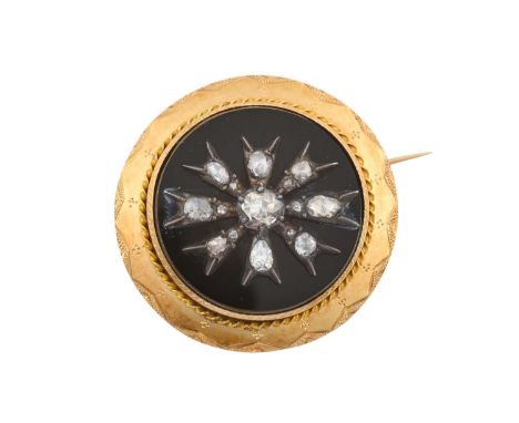 A 19th Century Diamond and Jet Broochthe circular jet plaque overlaid with a cluster of rose cut diamonds in white collet set
