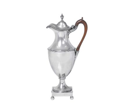 A George III Silver Hot-Water Jug,  by Charles Wright, London, 1779 vase-shaped and with beaded borders, on square base with 