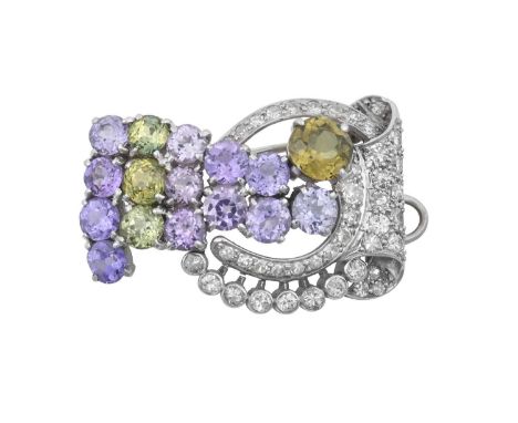 A Peridot, Amethyst and Diamond Broochof scroll form, set throughout with round cut peridot, round cut amethyst, round brilli