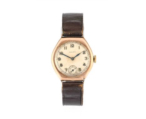 Rolex: A 9 Carat Gold Tonneau Shaped Wristwatch, signed Rolex, 1936, manual wound lever movement signed Rolex, silvered dial 