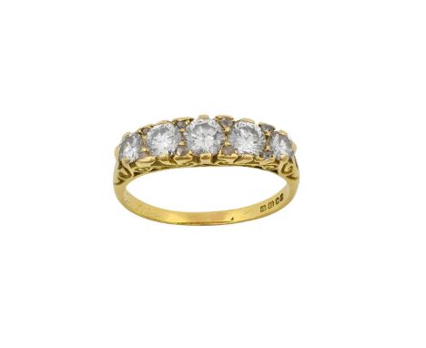 An 18 Carat Gold Diamond Five Stone Ringthe graduated round brilliant cut diamonds spaced by rose cut diamond accent stones, 