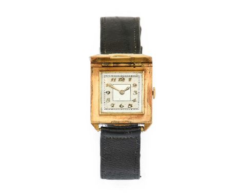 An Art Deco 18 Carat Gold Concealed Dial Wristwatch, 1930's, manual wound lever movement, two tone silvered dial with Arabic 