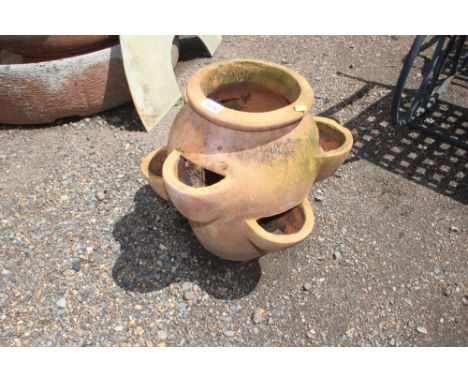 A terracotta strawberry planter