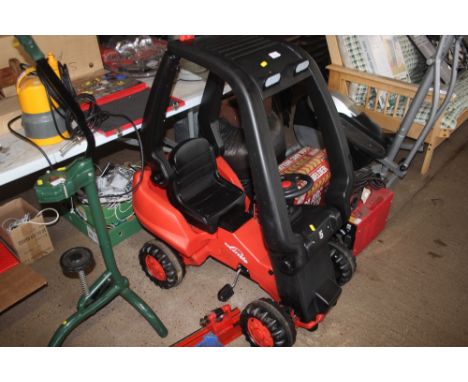 A child's pedal tractor 