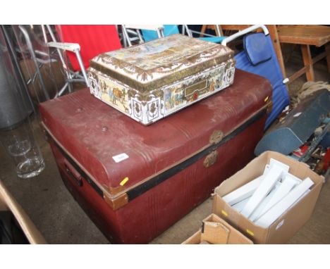 A metal trunk together with a metal tin