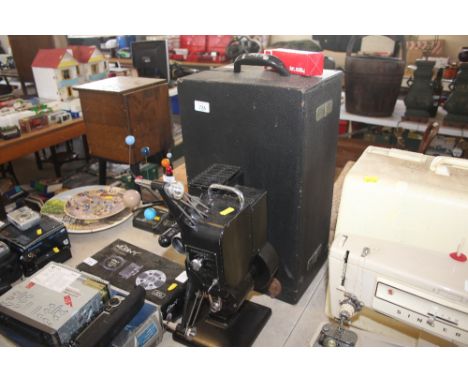 A Kodak projector in fitted case